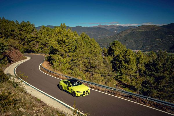 Lime green BMW on mountain road