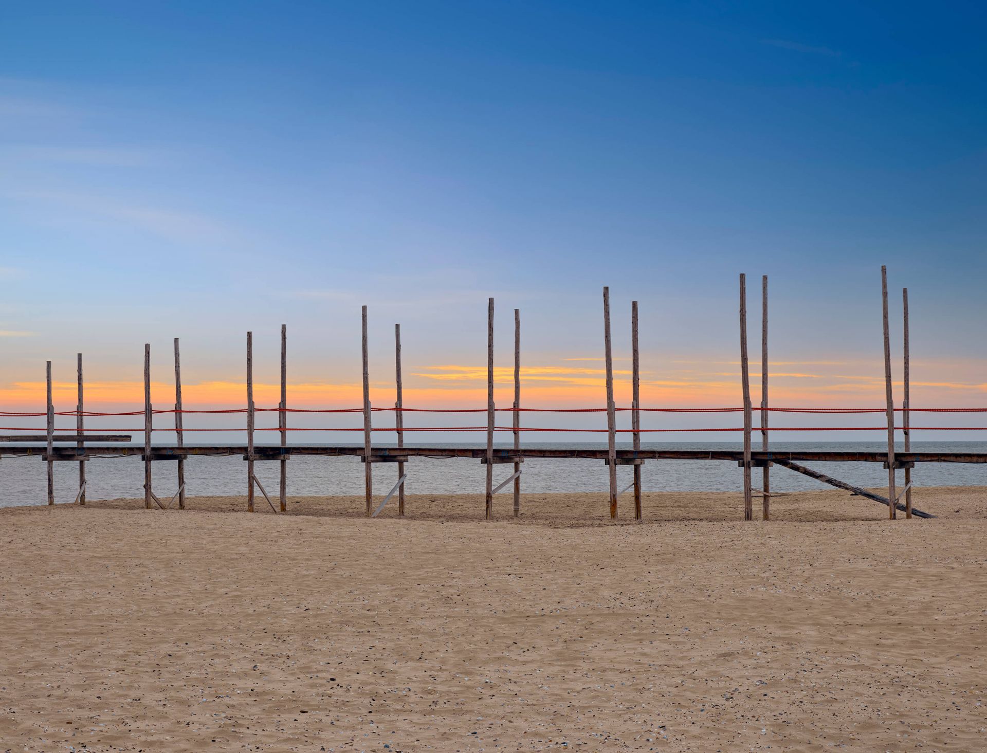 Long jetty with wooden posts