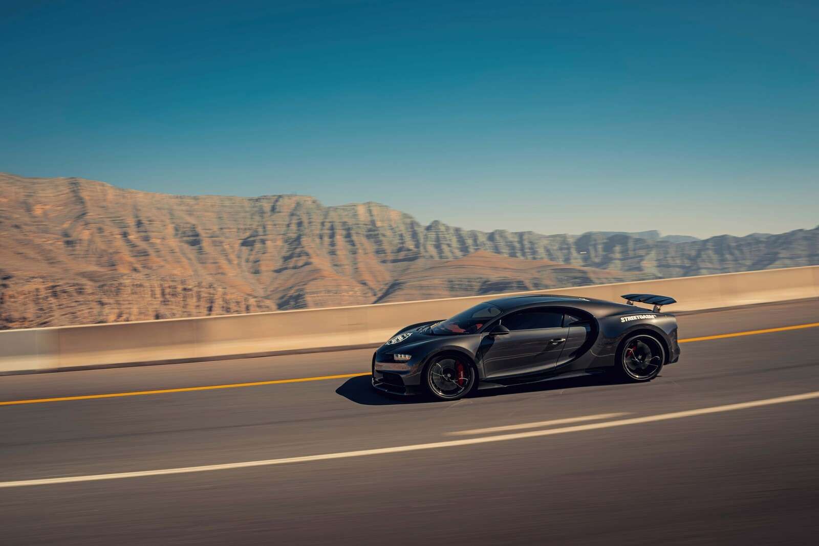 Hypercar against mountainous landscape