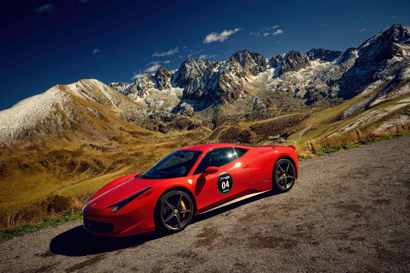 Ferrari 458 with the mountain peaks