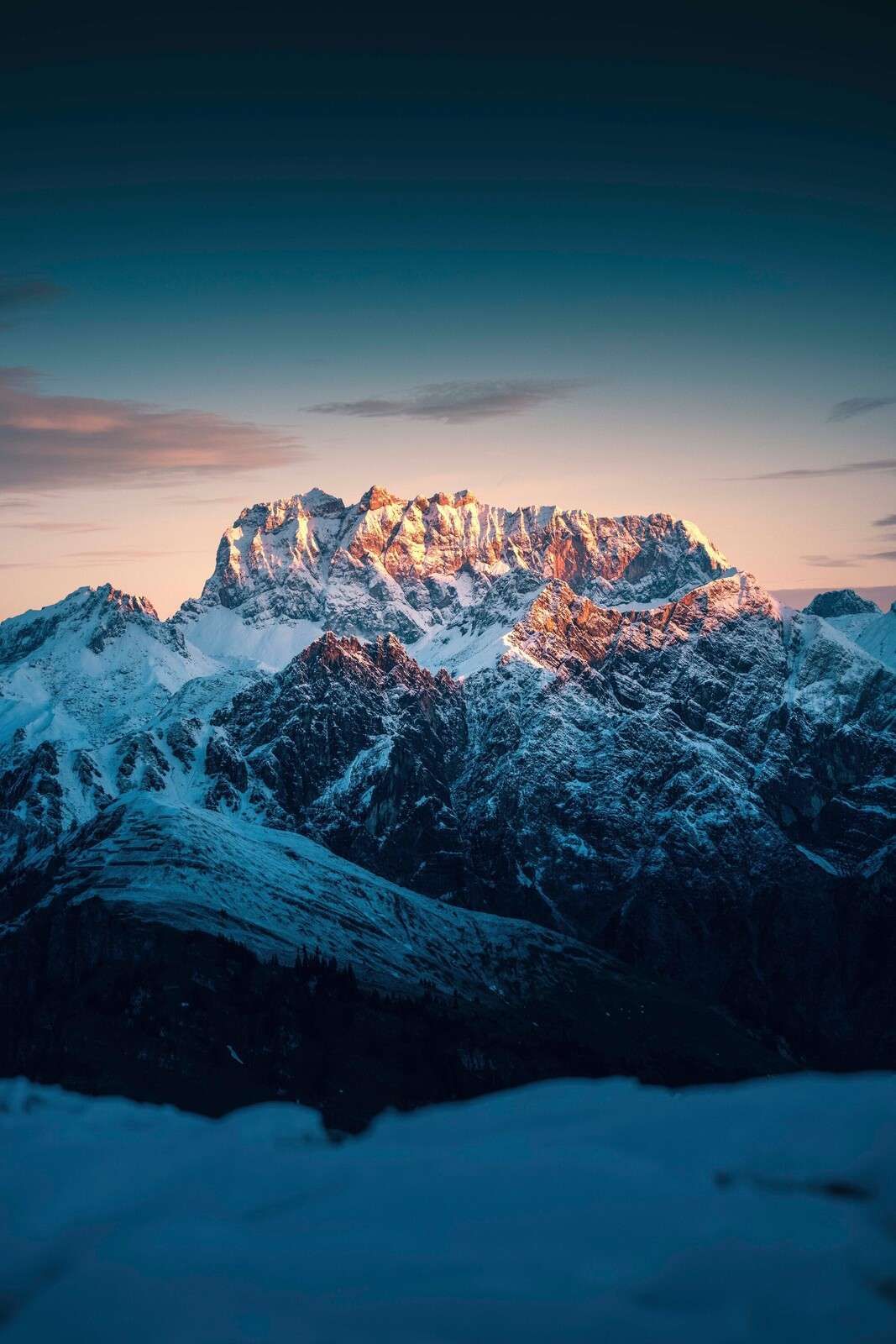 Evening light on snow-capped mountain peaks