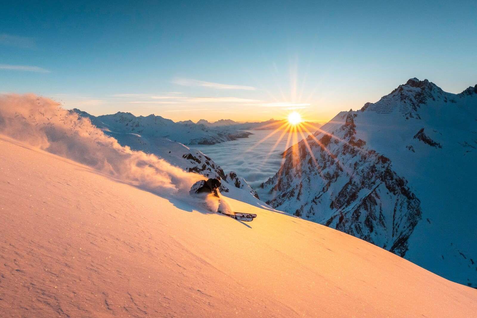 Skitour at sunrise in the Alps