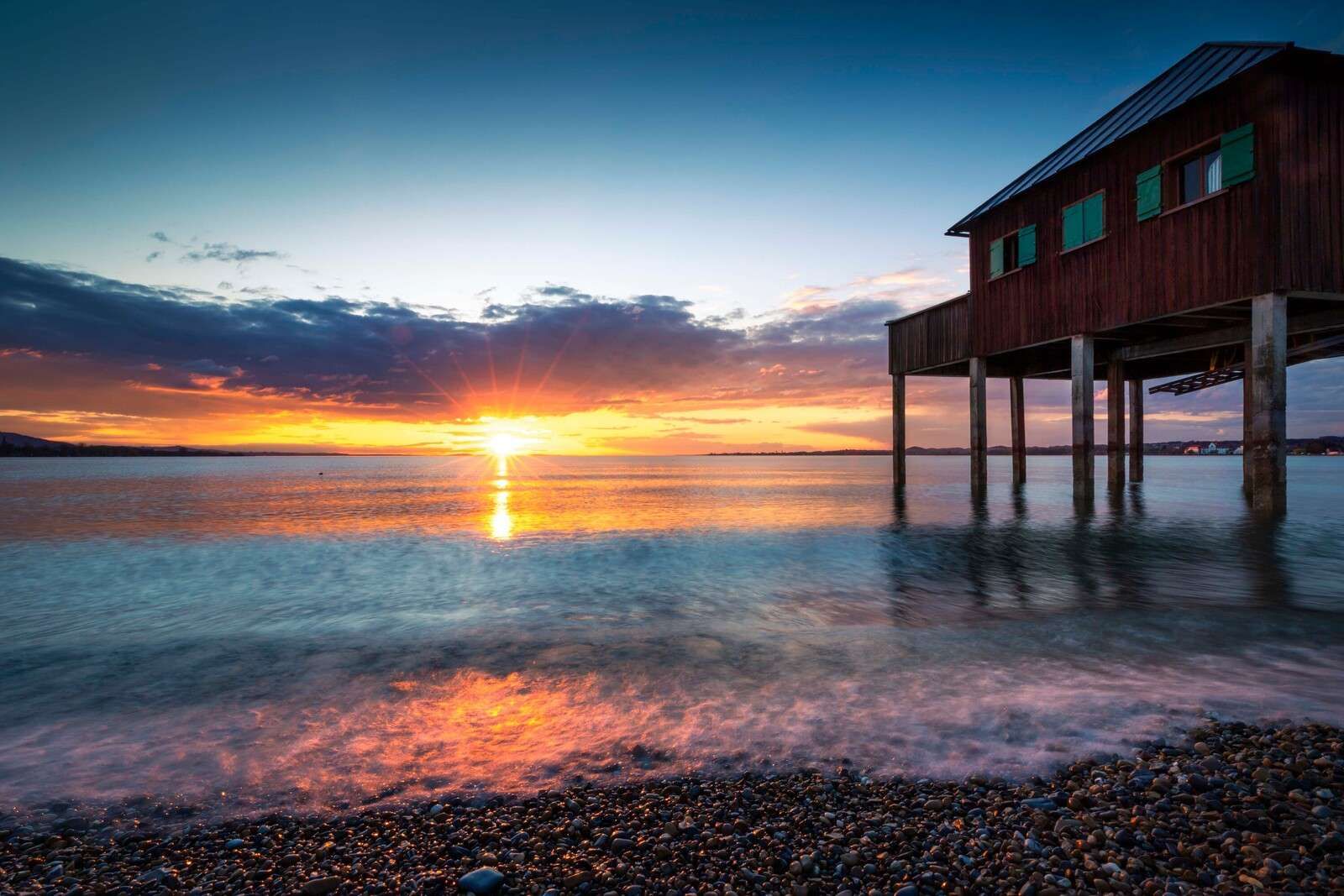 Sunset at quiet jetty house