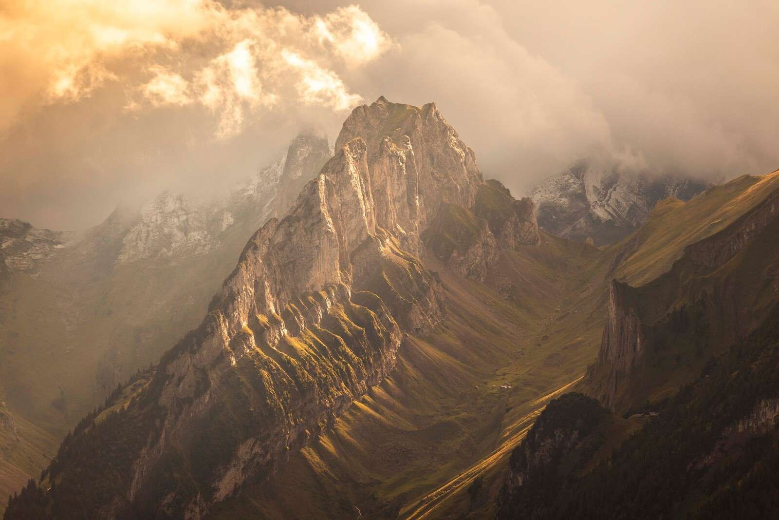 Golden sunlight on jagged mountain ridge