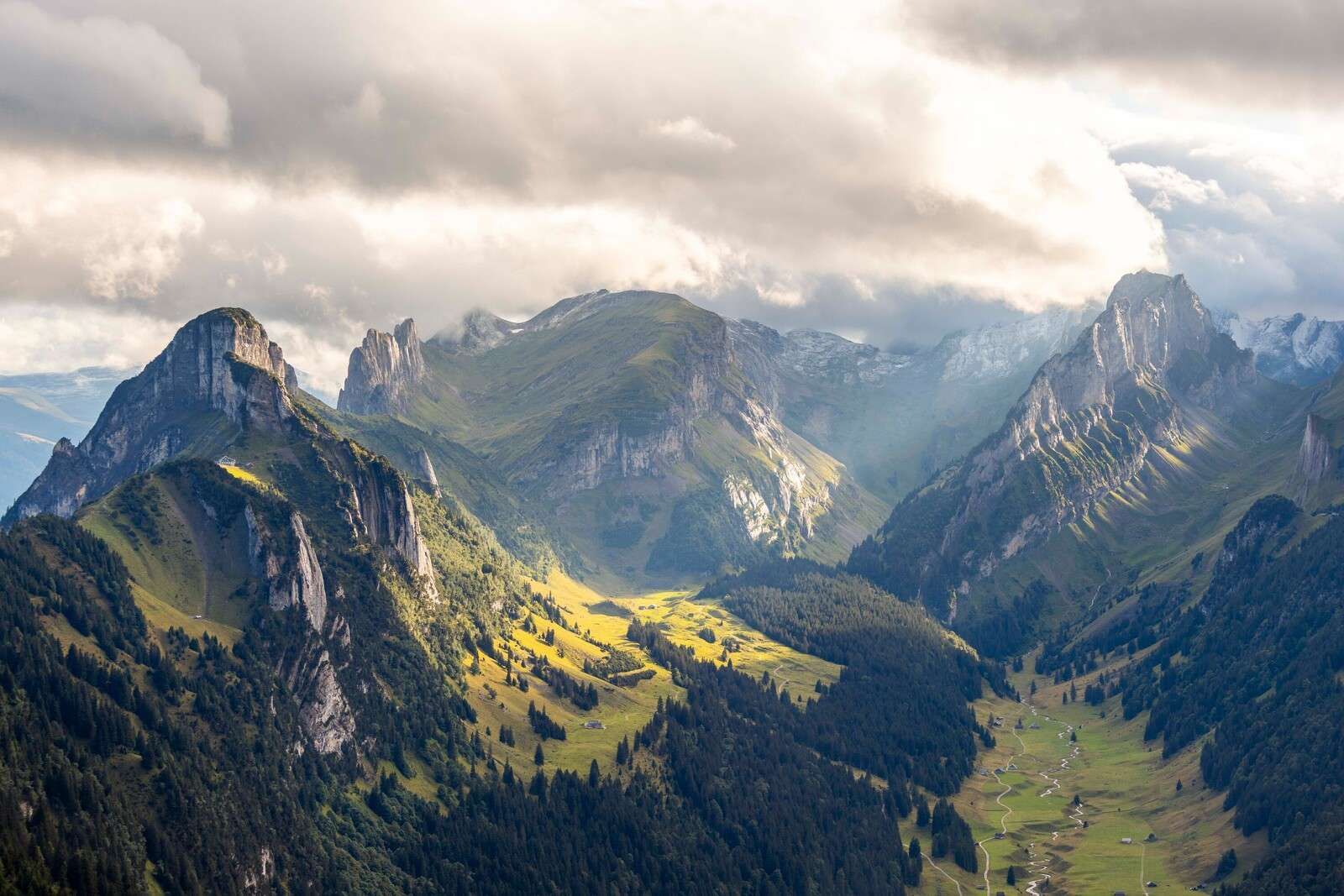 Sunlight over green mountain valley