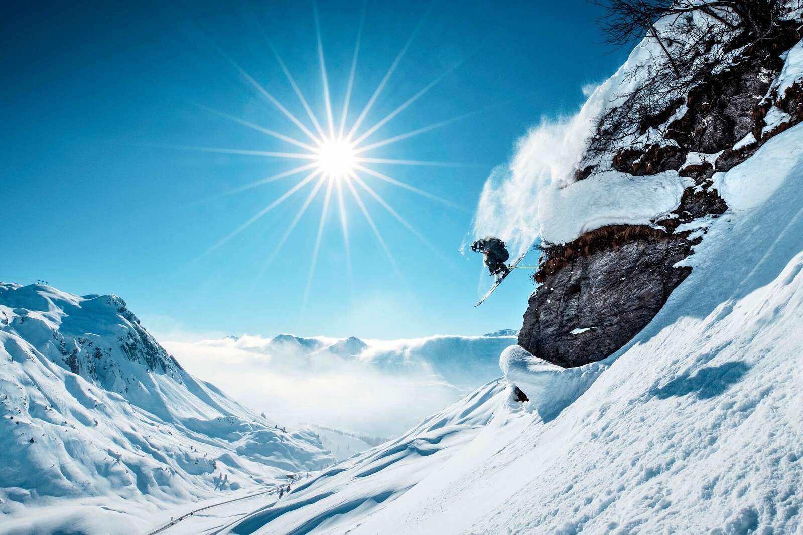 Free jump in sun-drenched snowy landscape