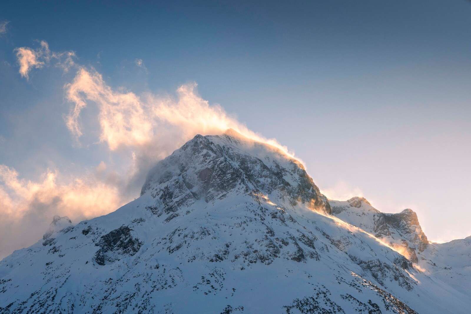 Mountain peak in fiery morning glow