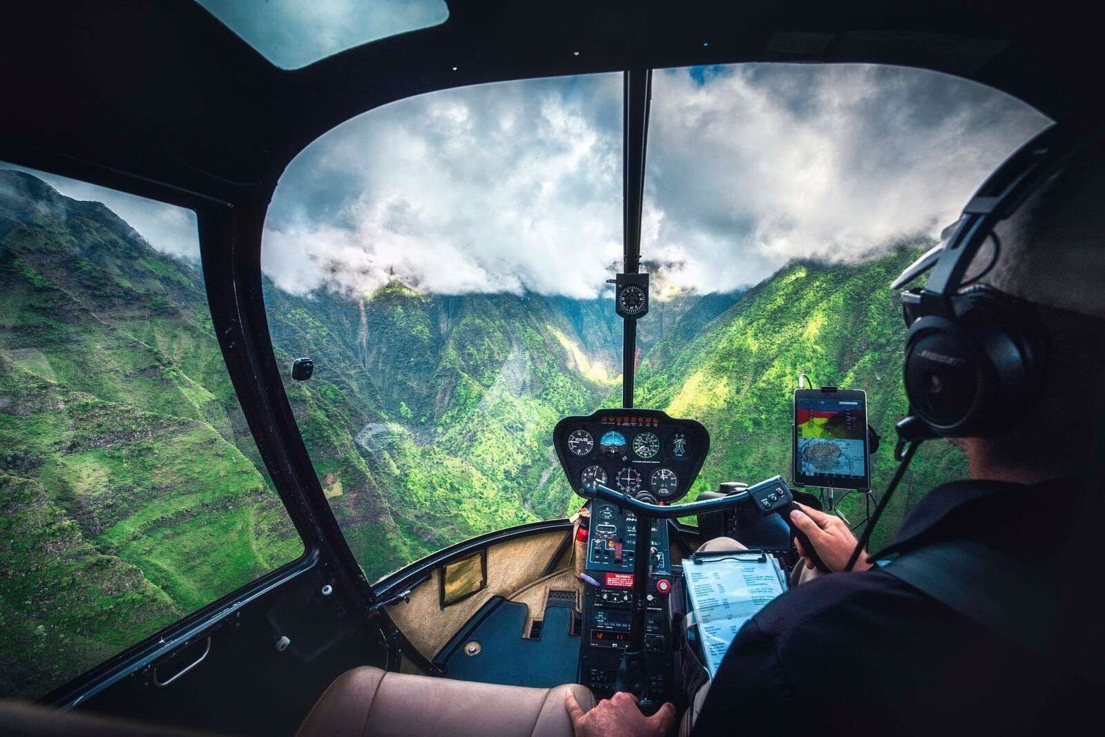 Helicopter flight above tropical mountain valley