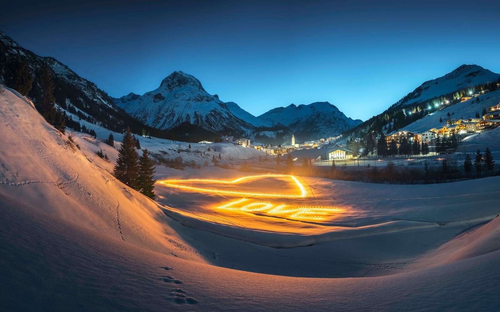 Light art in a winter mountain village