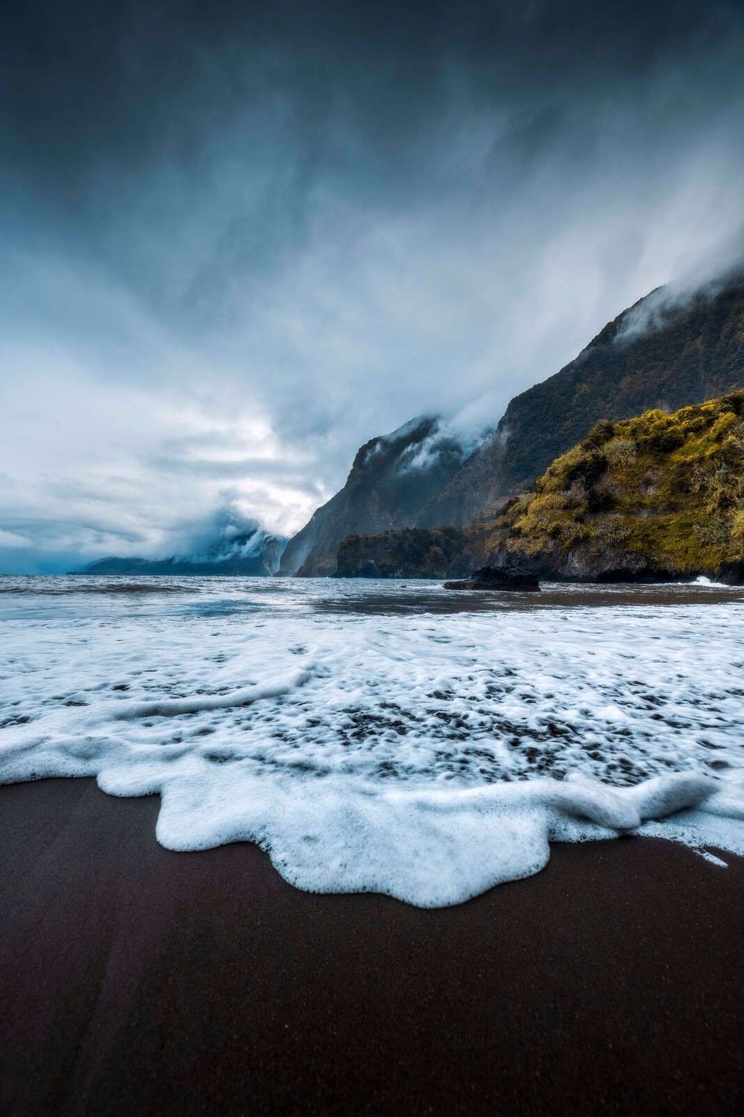 Dramatic coast with misty cliffs