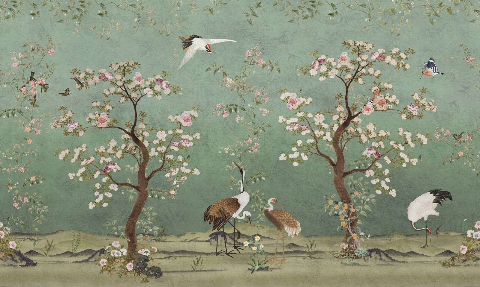 Graceful cranes in a blossom landscape