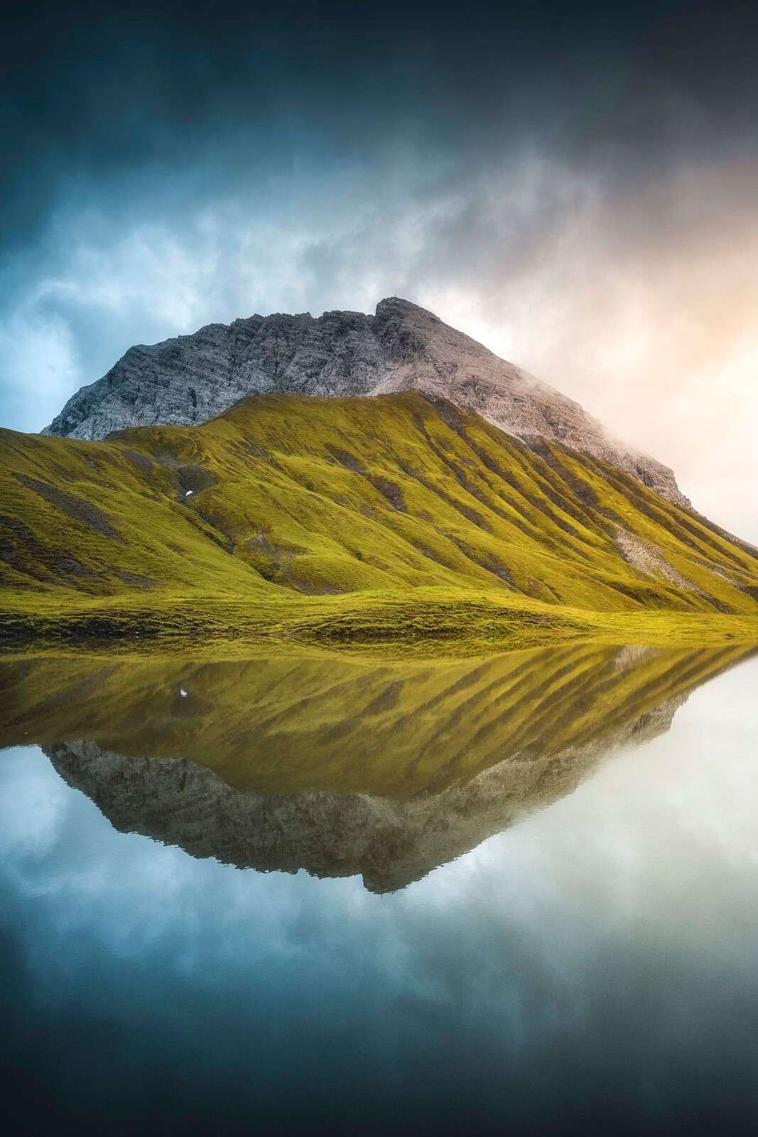Mountain top reflected in morning light
