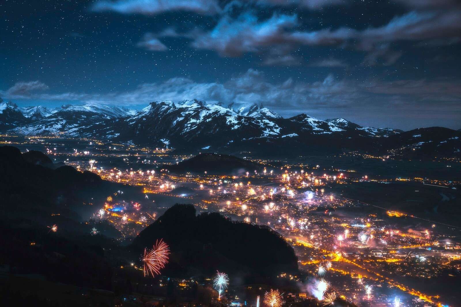 Firework light above alpine village