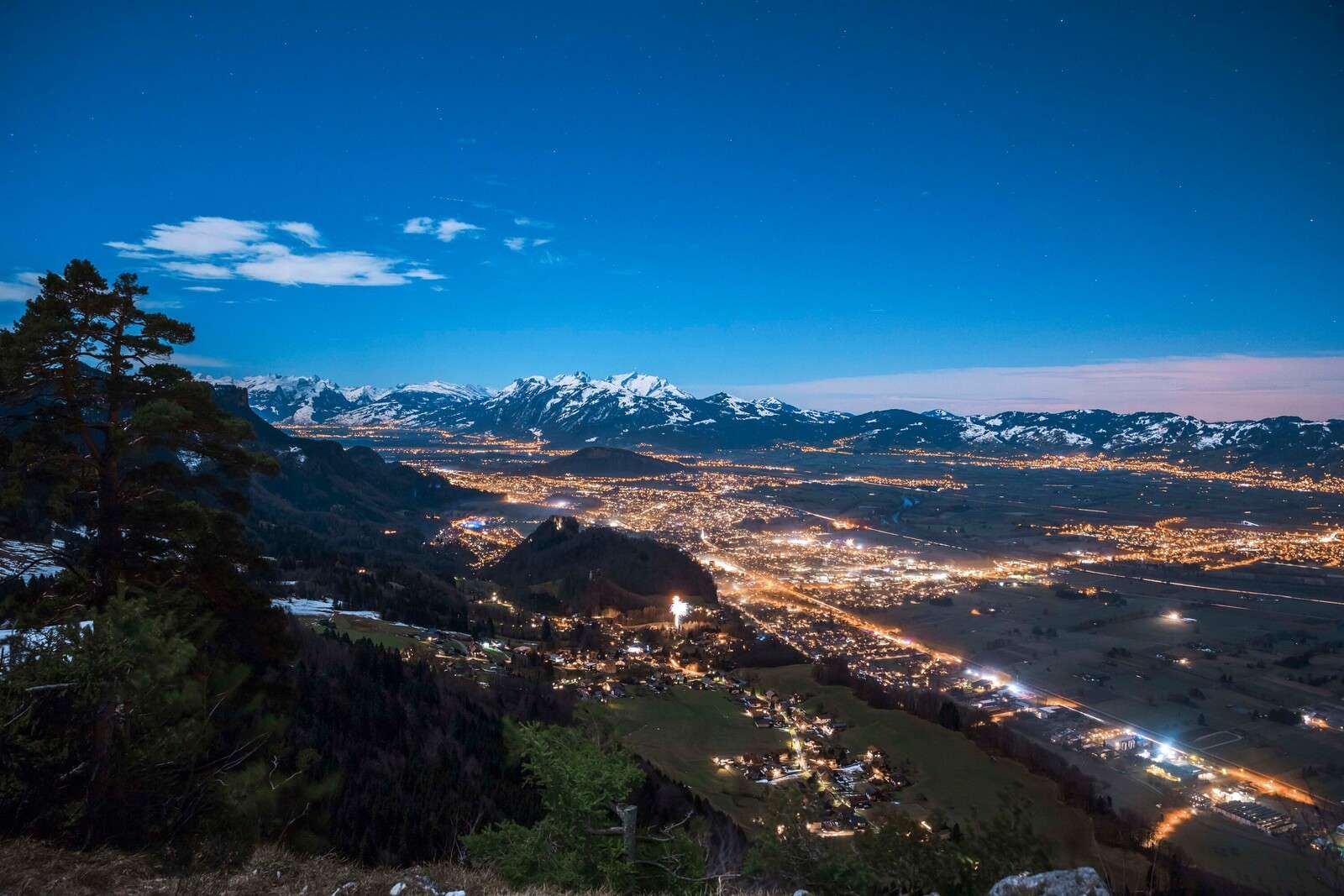 Night view over alpine valley town