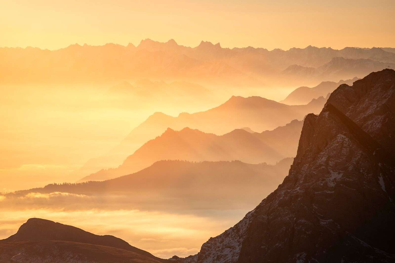Golden glow over mountain layers