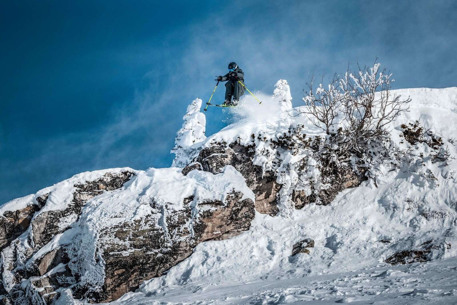 Freestyle skier in snowy mountain world