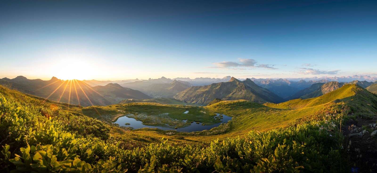 Sunlight over mountain valley