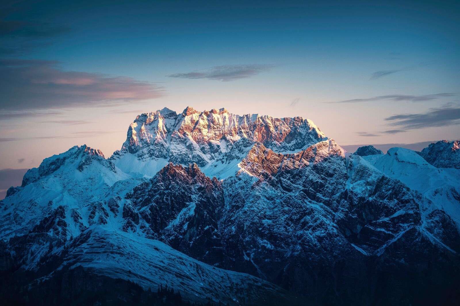 Evening glow on snow-capped peaks