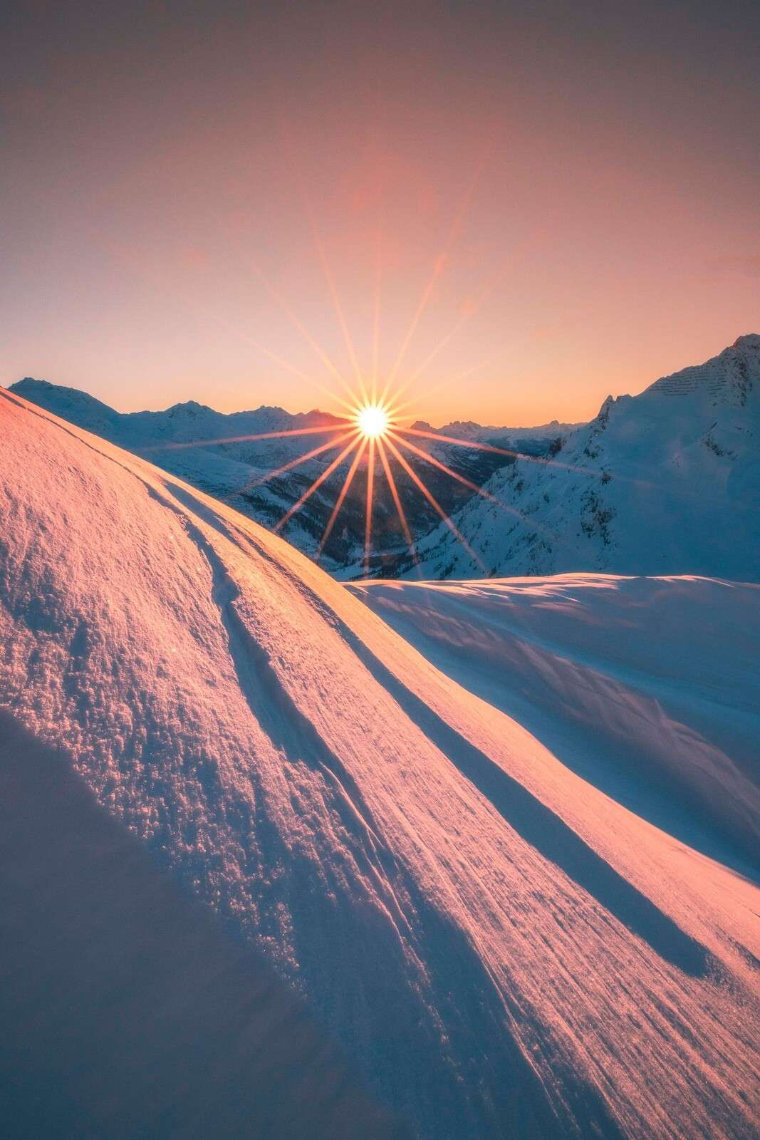 Sunlight over snowy slope