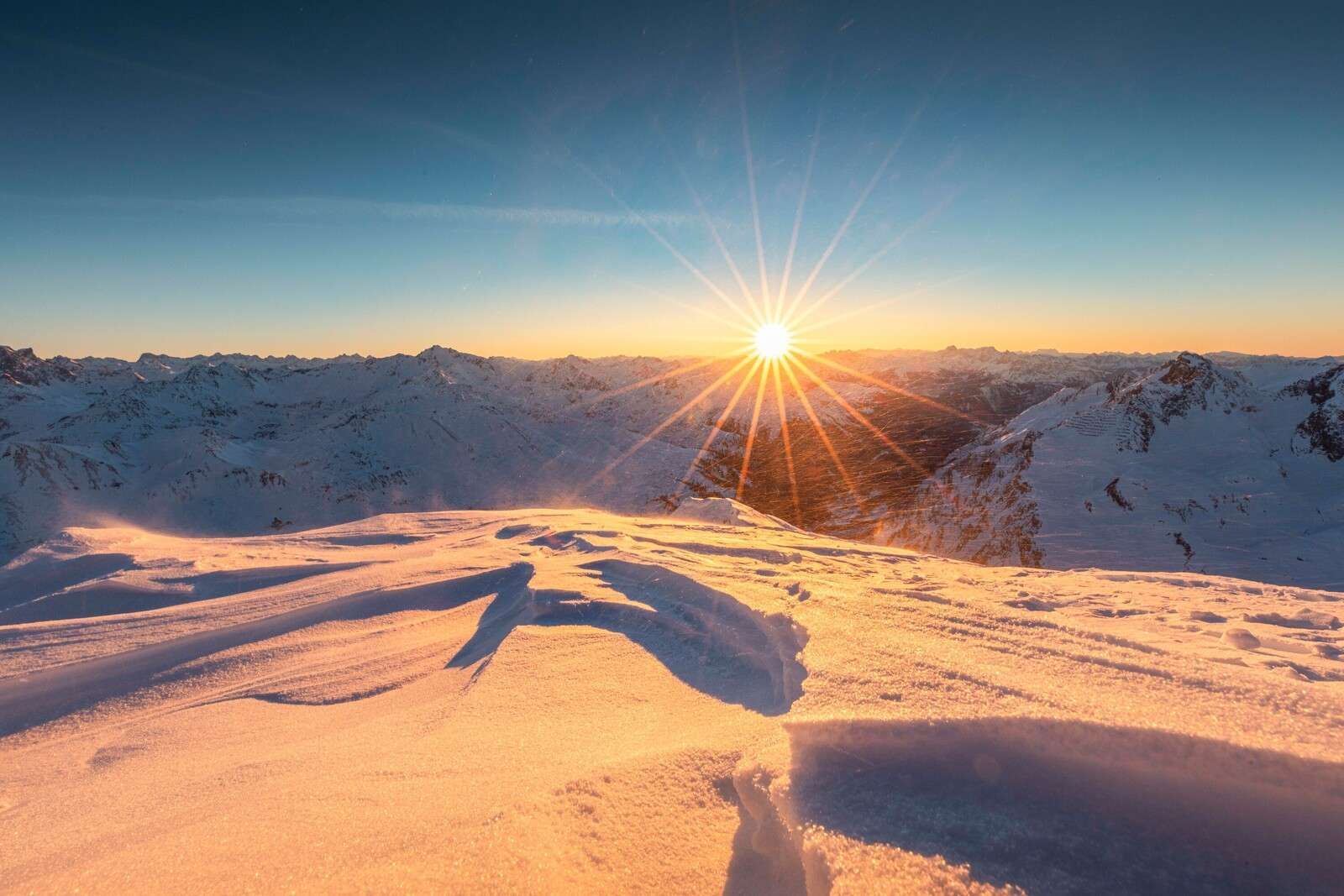 Sunbeams over snow plains