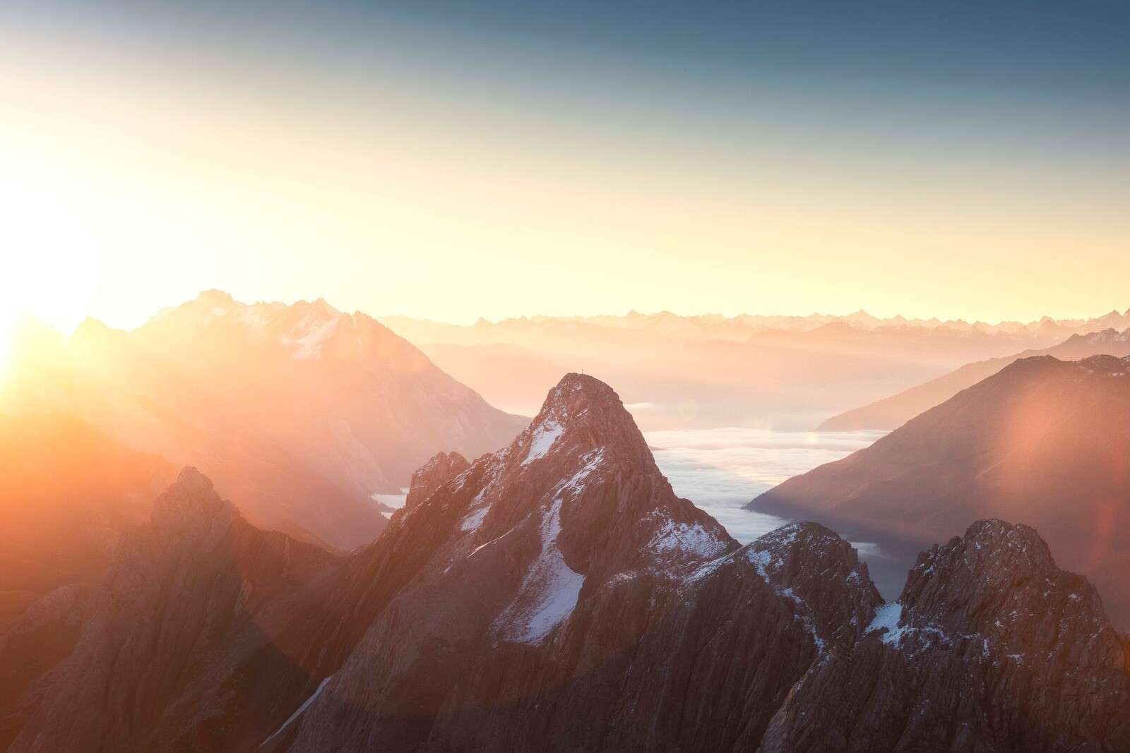 Sunrise Above Mountain Silhouettes