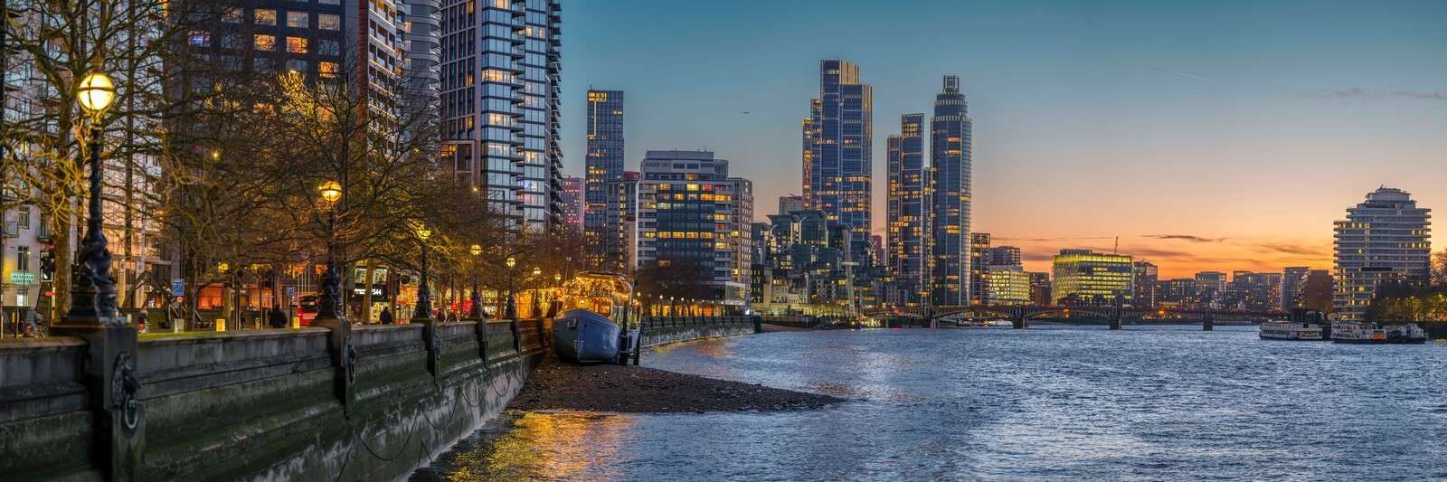 London cityscape over Thames river in evening