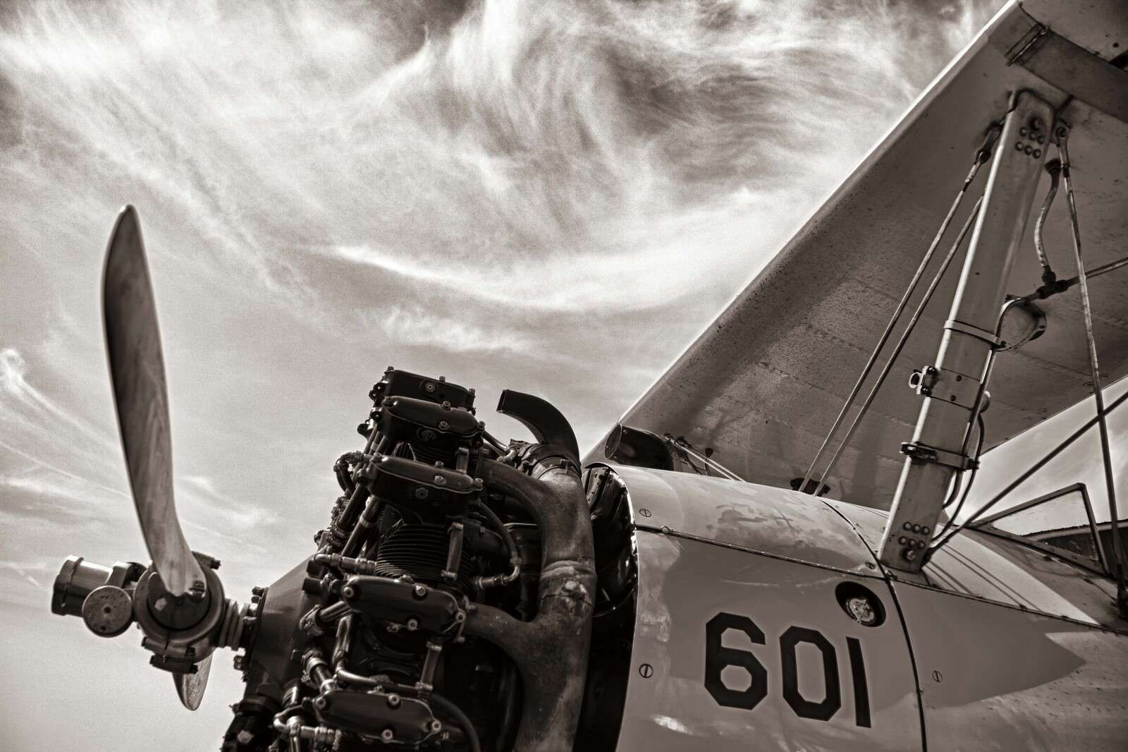 Vintage Propeller Flight Under Clouds