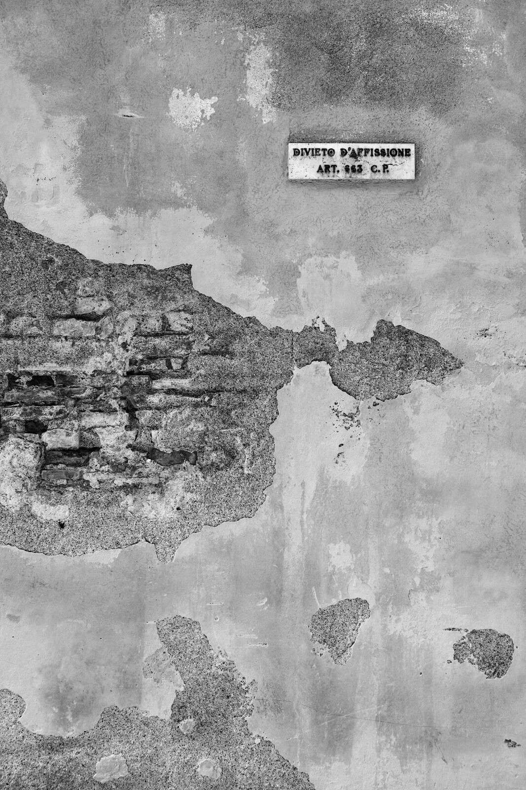 Weathered wall with Italian text