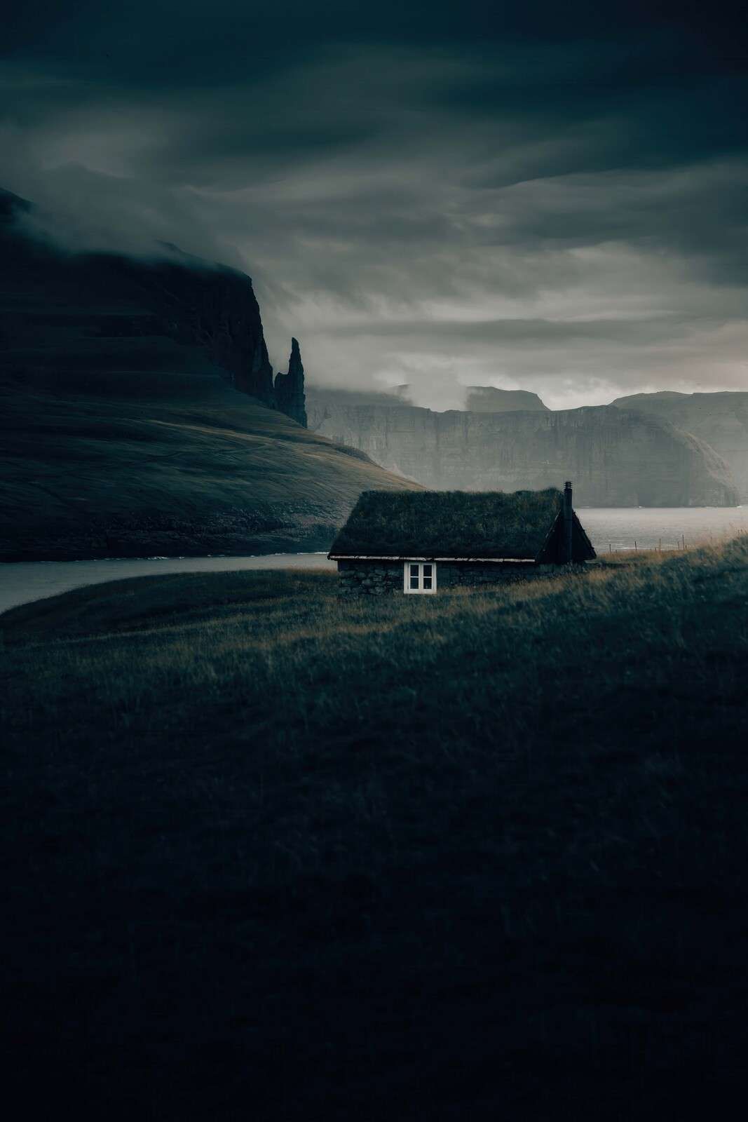 Cabin at the foot of wild fjords