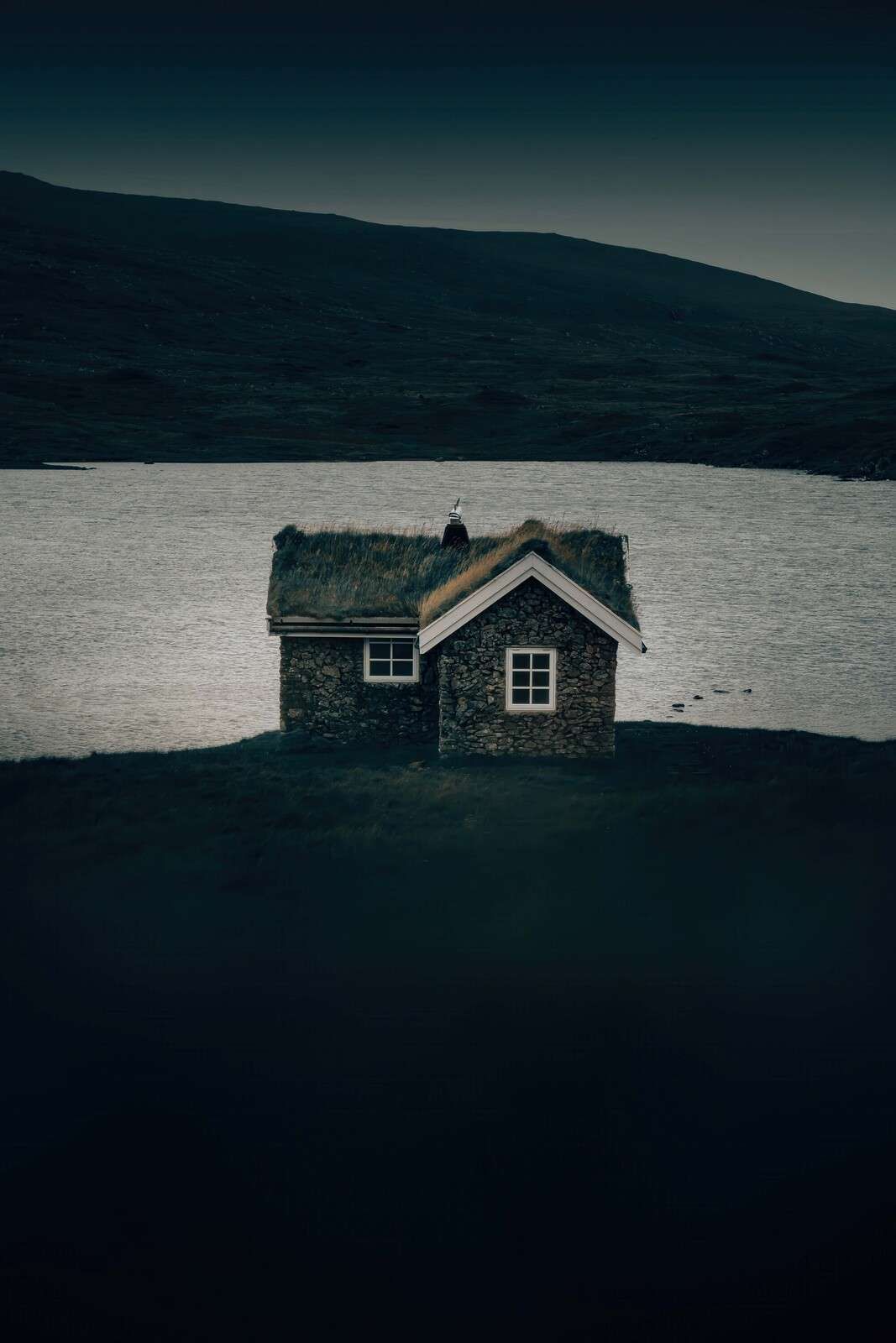 Small stone house on a quiet shore
