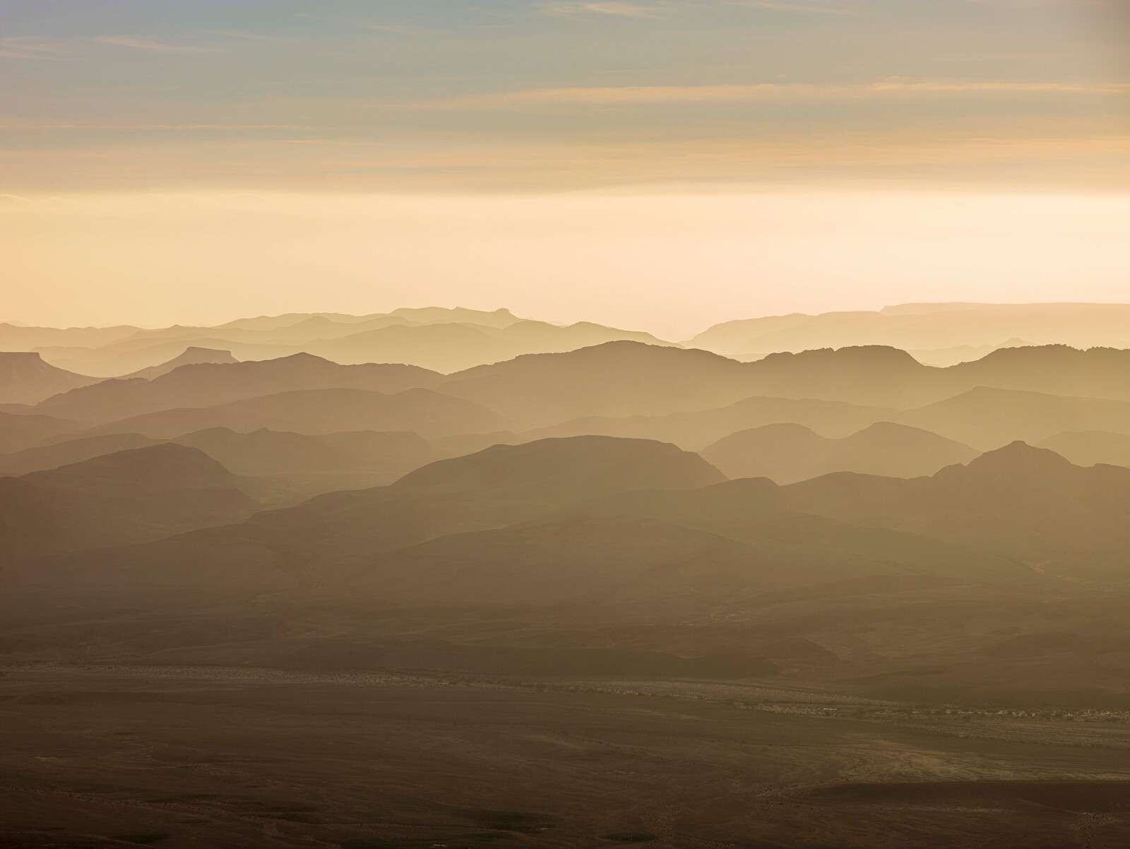 Layered mountain landscape in evening light