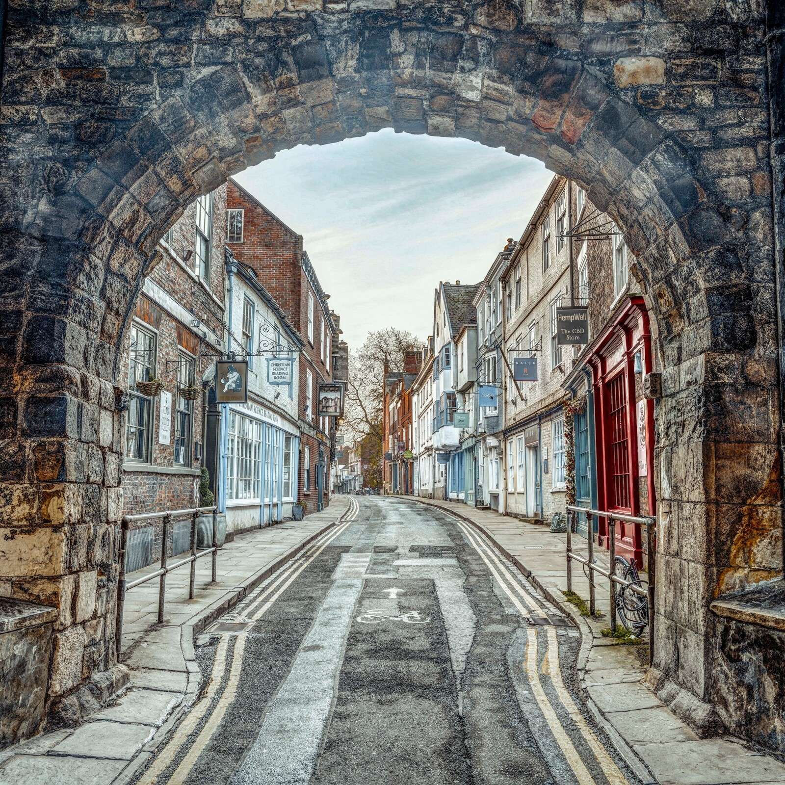 Historic street under stone archway
