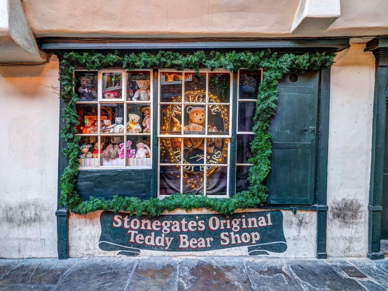 Nostalgic teddy bear shop with Christmas greenery