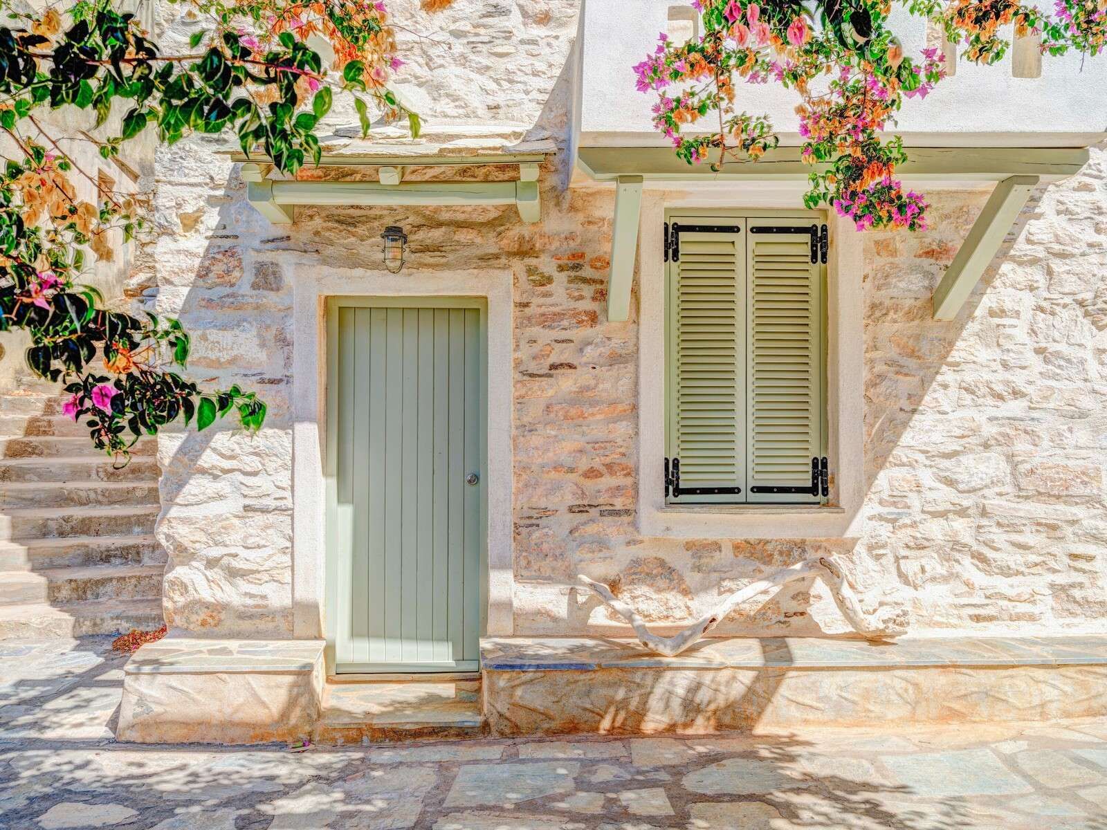 Mediterranean stone facade with bougainvillea