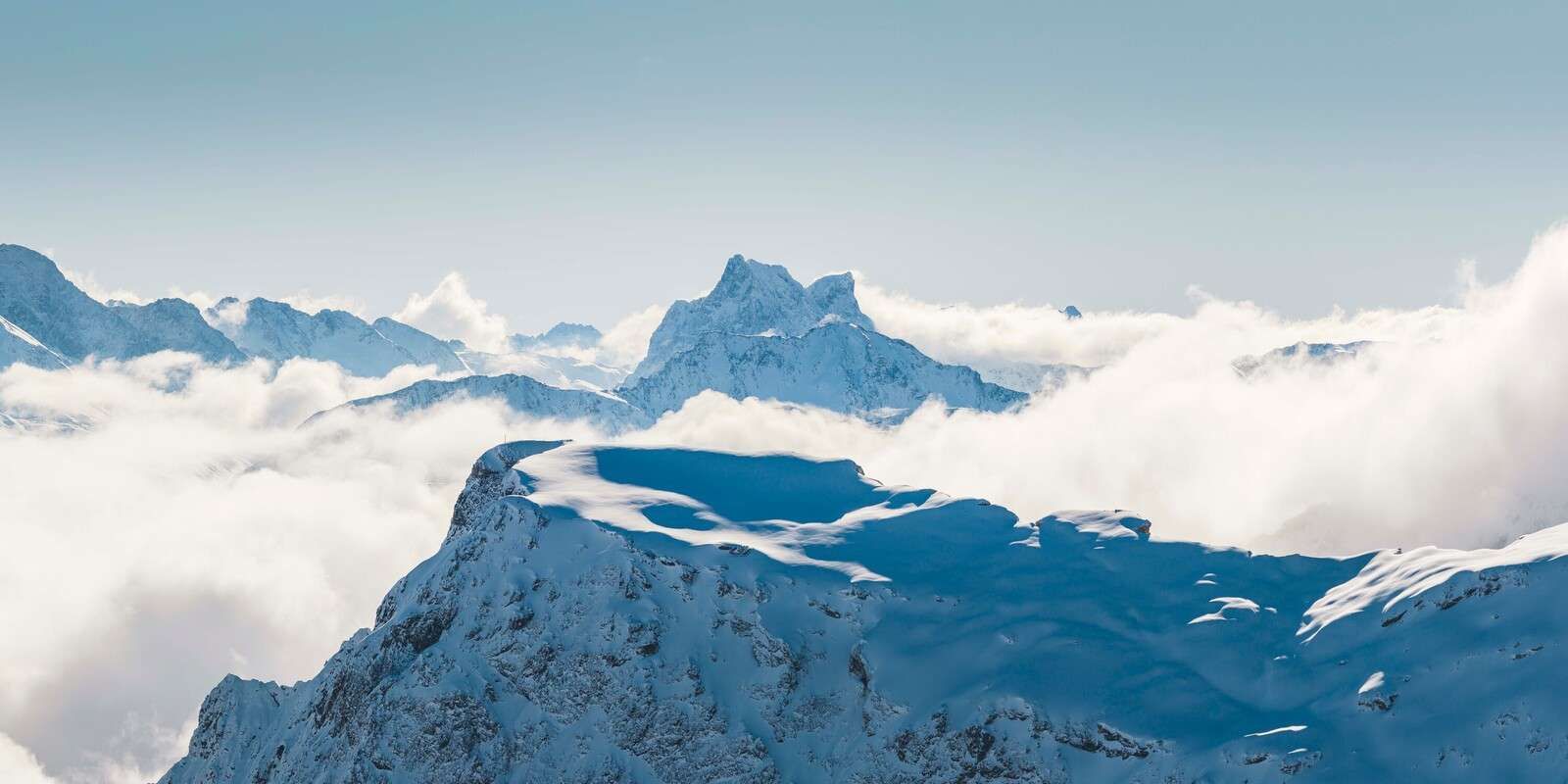 Snow-covered mountain landscape in the clouds