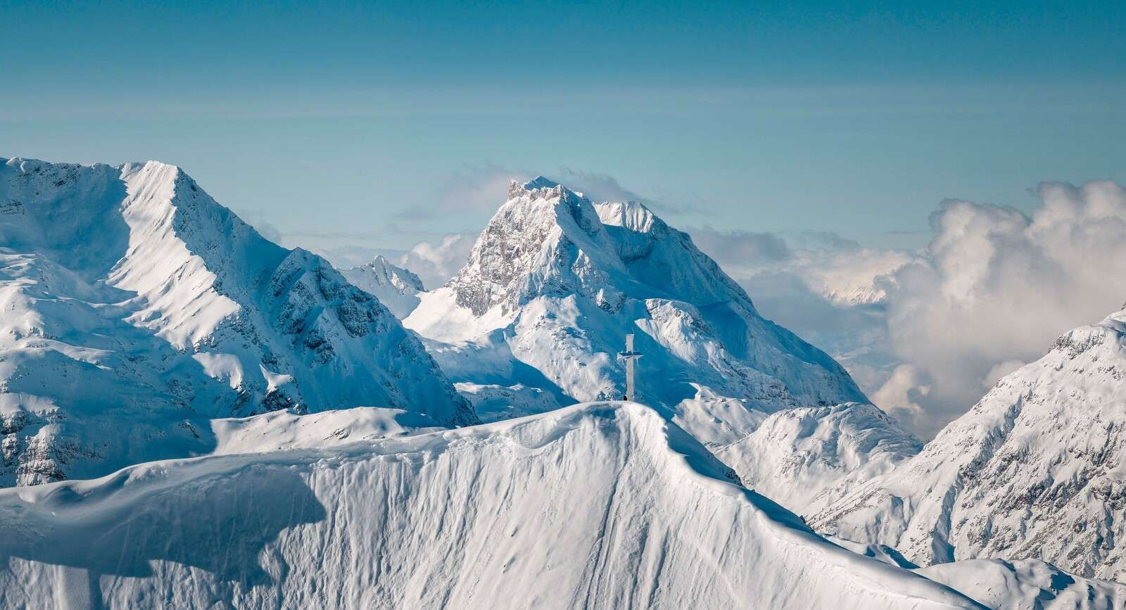 Winter mountains above a sea of clouds