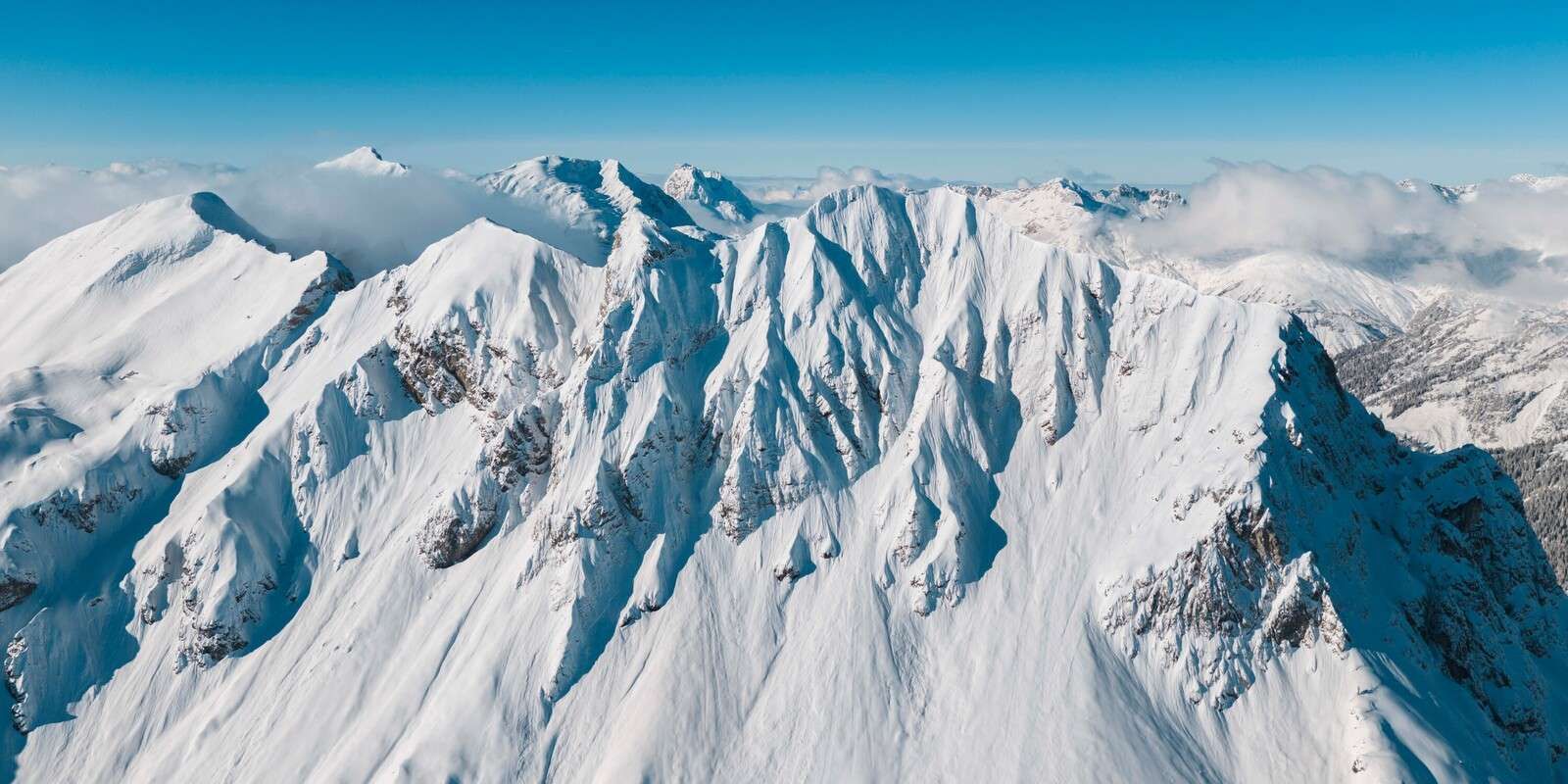 Icy mountain peaks in winter light