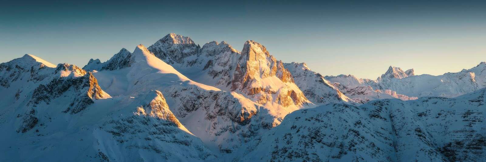 Winter sun on mountain peaks