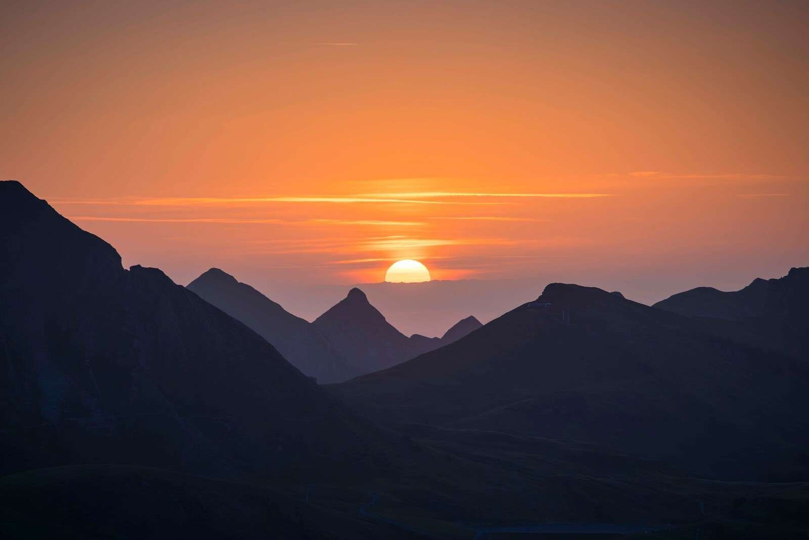 Sunset between mountain peaks
