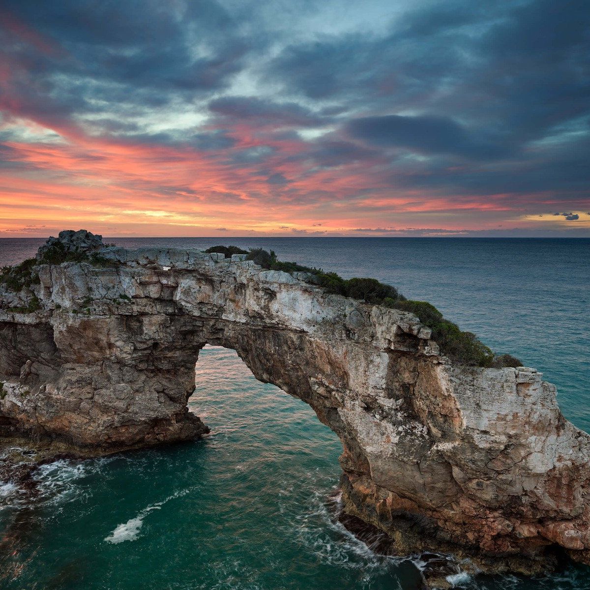 Curved rock in the sea