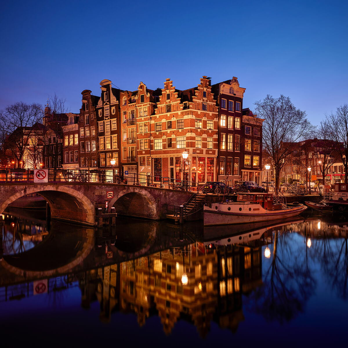 Illuminated houses along the canal