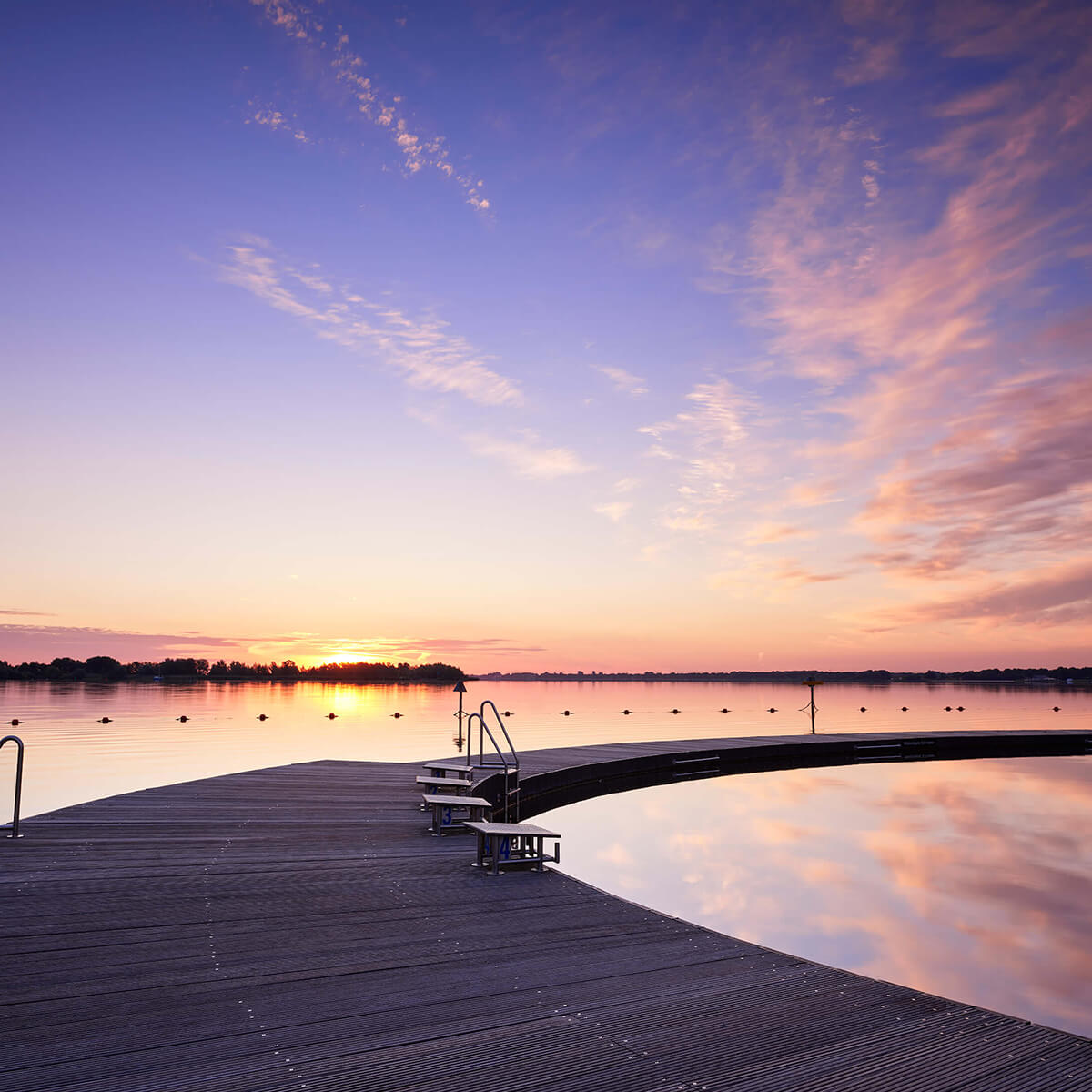 Swimming jetty with starting blocks