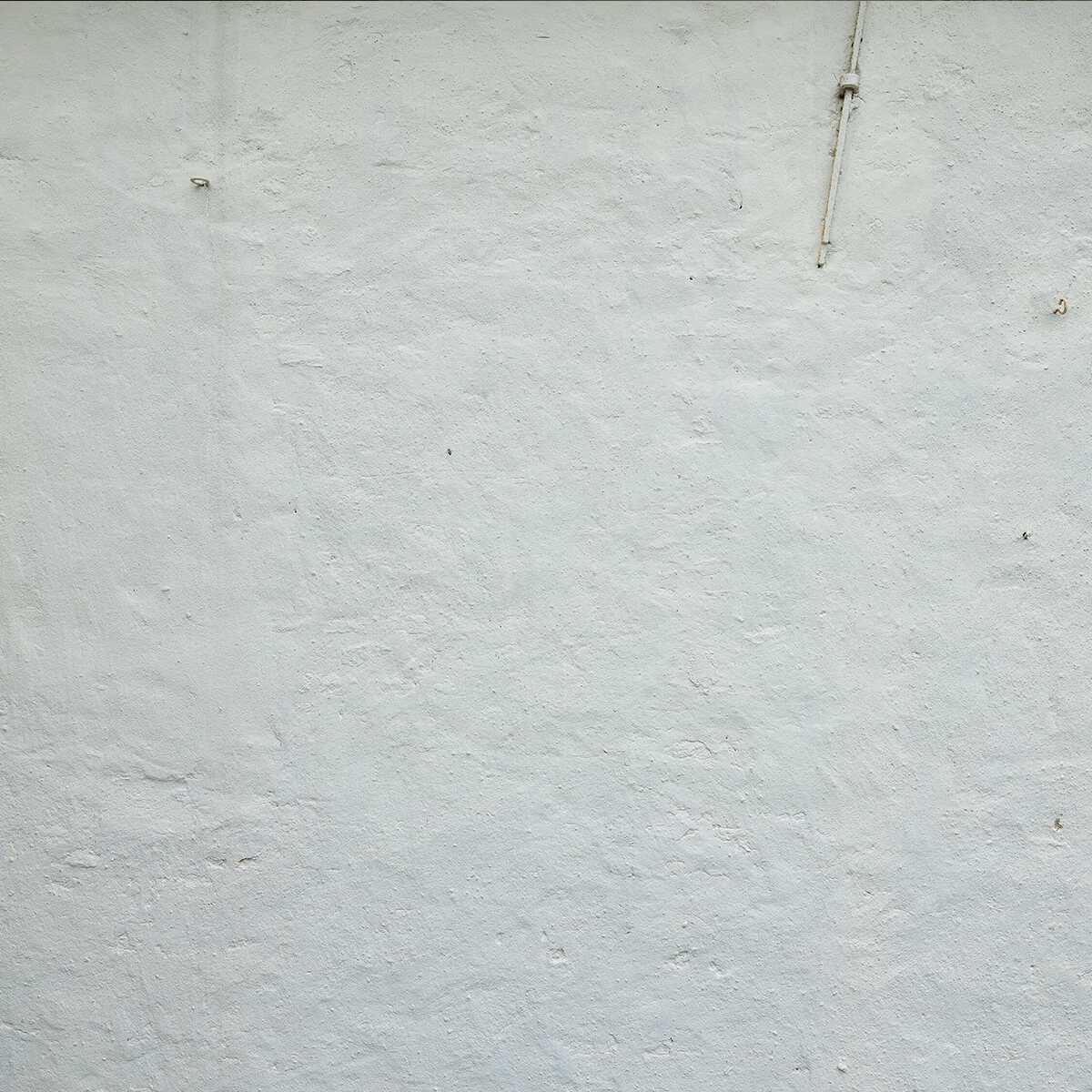 Wall with white stucco