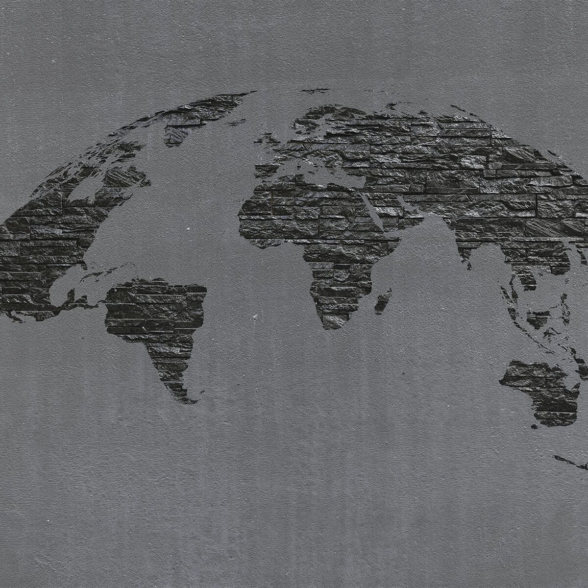World map stones on grey concrete