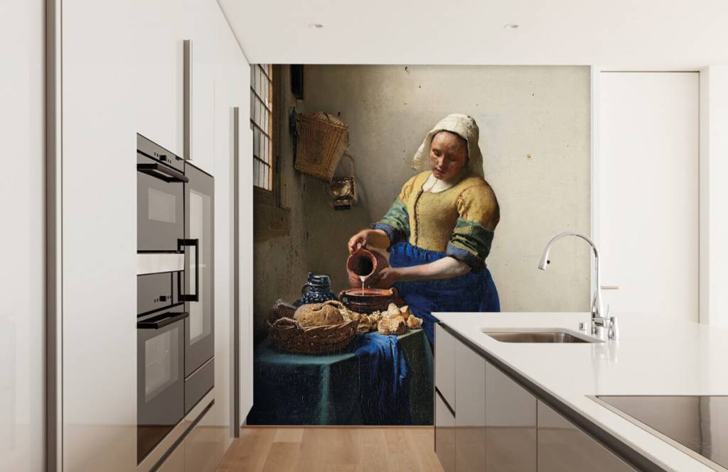 The milkmaid by Johannes Vermeer as photo wallpaper in the kitchen. 