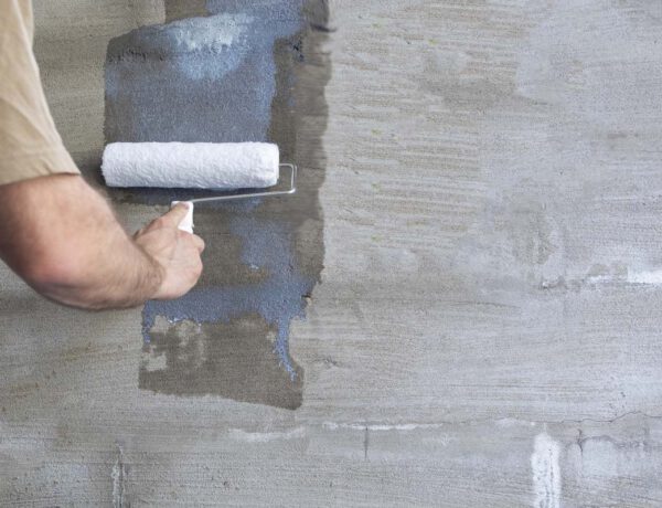 Wallpapering on a painted wall